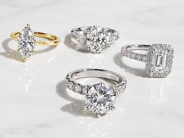 Marquise, oval three-stone, emerald-cut halo and round solitaire diamond engagement rings by Eternity Diamonds